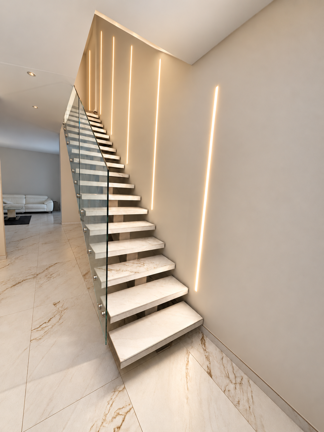 Éclairage linéaire intégré aux murs d’un escalier